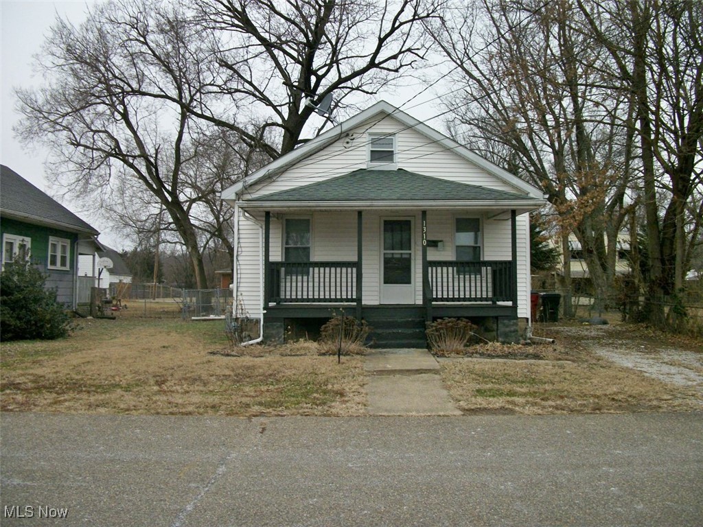 STARTING OUT OR WINDING DOWN, This cute and tidy 2-bedroom bungalow has a huge expansion space upstairs for a 3rd bedroom. the front porch offers ample space for family and neighbors to comfortably gather and engage in conversation. Hardwood floors through-out the home. The dedicated dining room off the kitchen could be an extension of the living room. New vinyl windows fill the home with natural light and offer durability and low maintenance. Rear yard leads to a fenced-in back yard. Whether its lawn games, a firepit or relaxation under the stars, this lot delivers potential for guest-friendly amenities. Updates include new 200 AMP electrical service, new breaker box and wiring for the entire home, copper and PVC water lines changed to Plex supply lines, cast iron sewer pipes replaced with CPVC pipes, new hot water tank, gas furnace and central air, new roof, and front porch. Conveniently located close to amenities and interstate highway. Come, look at this fresh clean home and with the vision, it could be yours.