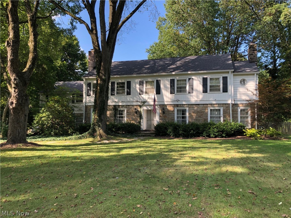 Set on the perfect street in the prestigious Fairlawn Heights, this house is a must see!  1940 Stockbridge has been well loved throughout the years.  When you walk in the front door you are greeted by original wood floors and a beautiful foyer that leads into a newly remodeled kitchen.  The kitchen has a Wolff range, wine chiller, large island, and granite countertops.  Next to the kitchen you'll find a breakfast sitting room as well as a beautiful dining room.  The living room has a large wall of built in bookshelves perfect for your library or special collections and a lovely gas fireplace.  Upstairs you'll find five possible bedrooms.  The master has a gas fireplace, it's own walk-in closet area, full bath, and walk out porch. There are two other full baths upstairs.  Two of the bedrooms and one full bath have their own entrance from the garage and can be blocked off from the main house to be used as a mother in law suite, rental, or as part of the main house.  There are two other v