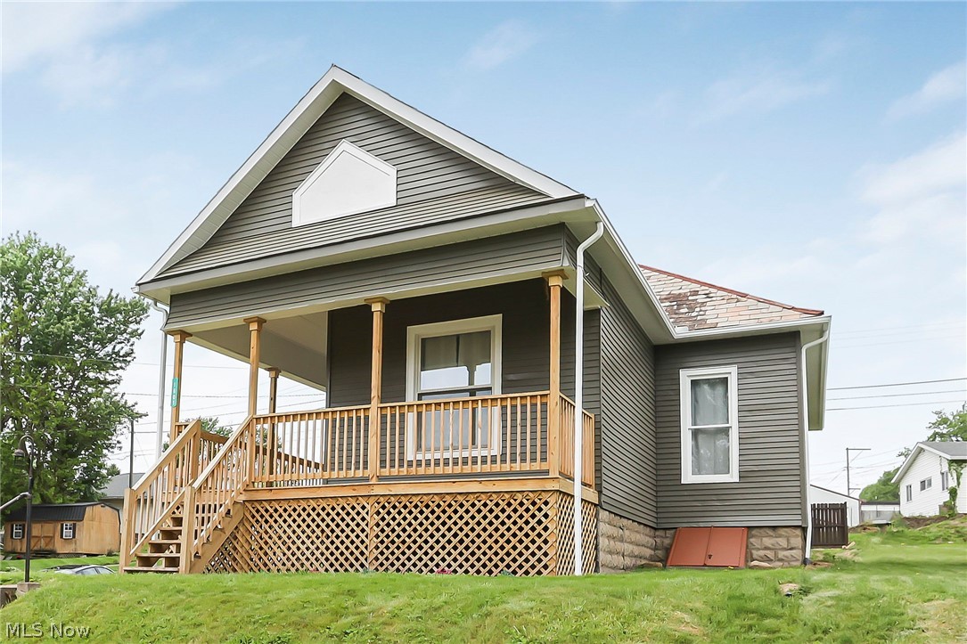 This charming, move-in ready, ranch-style home offers a perfect blend of character & updates in a convenient location
north of I-70. Step inside to find beautiful, original woodwork paired with new flooring & refinished hardwoods that
bring warmth & style to the spacious living spaces. The updated bathroom adds a fresh, modern touch. Upstairs, you'll
find a bonus attic space with great potential for a fourth bedroom, home office or flex space to suit your needs. Enjoy
the outdoors on the covered front porch or covered back porch overlooking the yard with privacy fencing. Freshly
painted inside & out, new furnace & hot water tank. This home offers charm & value for an owner occupant or
investor in a great location.