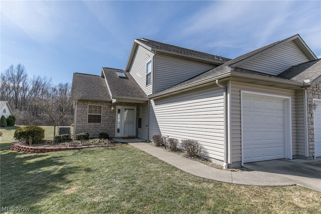 An exceptional 3 bedroom, 2 full bath Munroe Falls condo in the desirable Falls River Crossing.  This unit has an attached 2 car garage, first floor laundry, first floor bedroom, first floor full bath, private patio, and so much more.  The large Great Room has cathedral ceilings.  The upstairs consists of two large bedrooms, and a jack & jill bath.  The master bedroom has a huge walk in closet.  An open kitchen has an eating area.  The unit is all electric.