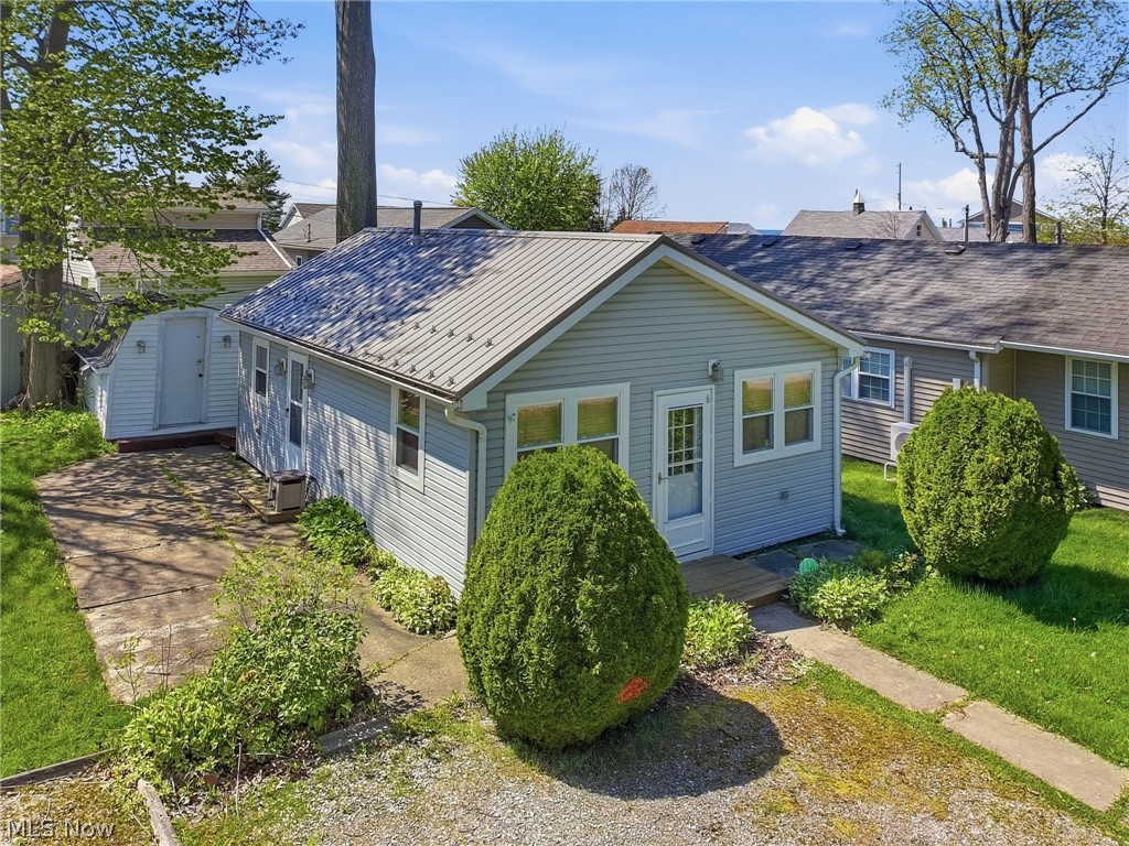 A-D-O-R-A-B-L-E  Looking for that cute summer cottage with Lake Erie access? Check this out!! Unique Camp on the shores of Lake Erie. Fully furnished 1-2 bedroom cottage. Patio and storage shed out back. Stairs lead down to private beach owned by
members of Ravine Camp Corporation. Camp is open/water turned on from mid-April through end of October yearly. This
is not a typical sale - no deed or title. Buyer will be purchasing membership into Ravine Camp Corporation and cottage.
You are responsible for maintenance of the lot. Cash Sales Only. The land is owned as a whole by the corporation. Updates
to the cottage- New Metal Roof 11/2025, updated bath, exterior doors and some windows (4 years), flooring (5 years), Electrical panel, and line from pole (2024) updated exterior lighting (7 years), plumbing (5 years). Attic propane furnace (tank will be needed to use this furnace), window a/c unit and laundry hookups in unit. If you are looking for a summer hang out at the beach, don't miss this opportunity. $500 new member fee is due to any new member of Ravine Camp Corporation.  Saybrook Township park is 1/3 of a mile west, 5-miles to Geneva On The Lake, 4-miles to Ashtabula Harbor District and public beach. Launch your boat at either Geneva State Park or Lakeshore Park. All 5-6 miles away. Ashtabula County offers loads of wineries, beautiful beaches, restaurants, entertainment and more. Another possibility - snag the location - build something new. Buyer to do their own due diligence as to what can be built within the camp and Saybrook Twp. Rentals of any kind are NOT permitted in Ravine Camp Corporation. Gated entrance - appointments required.