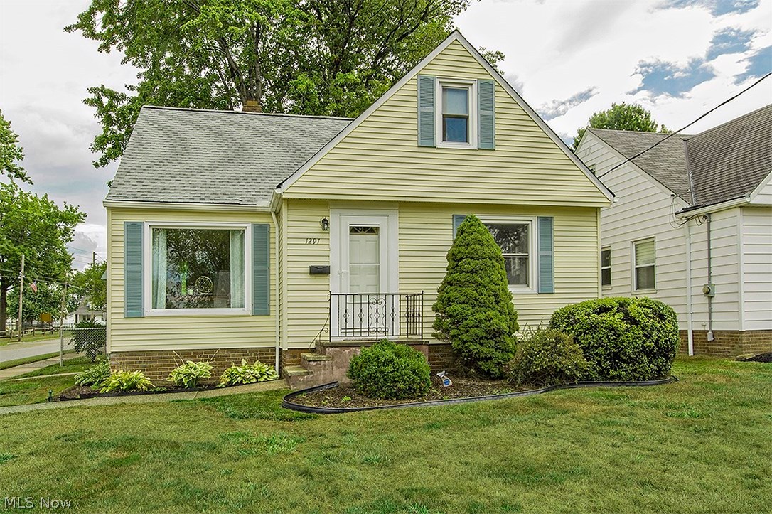 Sharp bungalow/cape cod that is has been beautifully maintained! Hardwood floors throughout the living room & dining room. Gorgeous picture window overlooking the front yard. Open kitchen w/ all appliances. Cozy family room w/ walls of windows with fireplace that overlooks an amazing deep backyard. Not your typical Mayfield yard!Two bedrooms with full bath on main level with huge 3rd bedroom on second floor w/ brand new ceiling. Amazing finished lower level rec room with new ceiling, full bath, laundry and walls of storage.  Detached 2 car garage. Fully fenced in yard. Updates include a newer roof, windows, hot water tank & updated electrical. Freshly painted throughout. Clean and neat. Park is conveniently located right across the street. A must see for Mayfield!
