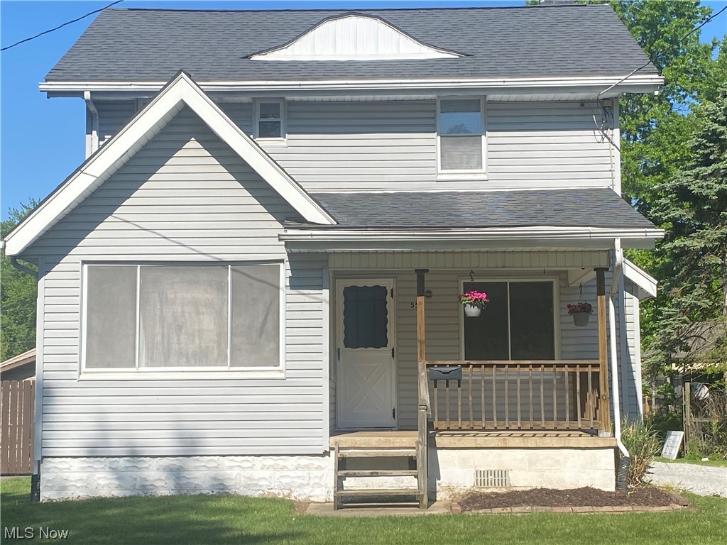 This charming home is move-in ready, super clean, fresh throughout and located on a beautiful street close to Goodyear Hts Metro Park.  After work enjoy the relaxing covered concrete front porch (11 x 8 ).  A cheerful alcove off living room offers office, reading, toy or craft room options surrounded with large windows.  All brick fireplace in roomy living room has a spacious mantle.  Brand new waterproof vinyl-plank flooring in kitchen located next to nice dining room with handy built-in china cabinet.  Stove is electric with a gas line also available. Bedrooms have large closets.  Home has newer central air.   Laundry is located in the unfinished basement.  Mechanicals appear to be in good condition; however, seller providing 1 year Home Warranty for extra peace of mind.  There is a short walk-up insulated attic.  The level, mostly fenced, spacious backyard is great for BBQ picnics and various family events.  Detached 13 x 21 garage has a concrete floor.  A 10' x 9 1/2' concrete pad
