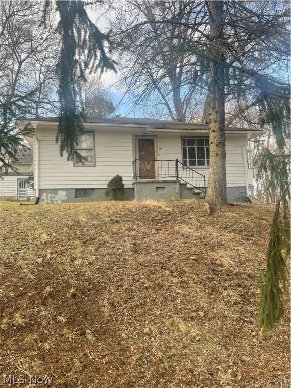 Cute and Cozy 2 bedroom ranch home in Lacroft.  Natural Hardwood floors in livingroom, hallway and both bedrooms. Basement has two additional rooms and a laundry area with a washtub. 1 car detached garage with concrete floors. Hot water tank is owned. Gas bill average is $80, Electric average is $100 and the Water/Sewer/Trash runs approx. $93. Road is well maintained in the winter months.
