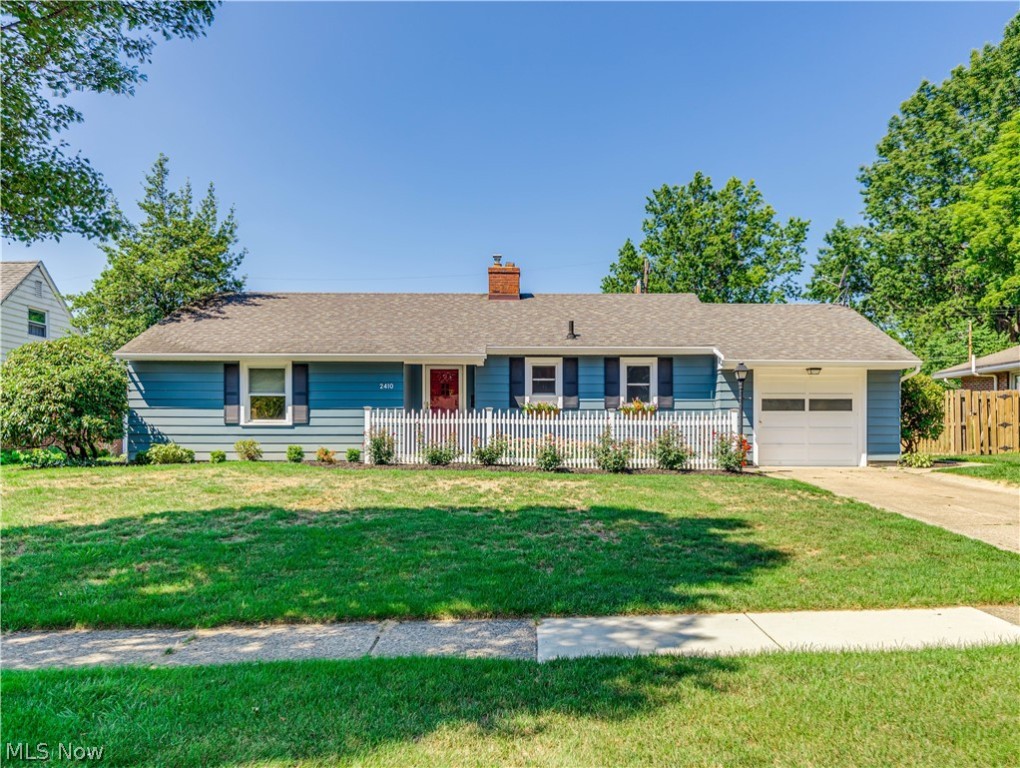 If you have been waiting for a “white picket fence” moment while looking at homes, stop your search. This stunning ranch is located in one of the most sought-after neighborhoods in Cuyahoga Falls and has both outside curb appeal and inside charm. A brick walkway leads to an inviting entrance. Open the door to a foyer that leads you to the large 25 x 12 living room, dining room combination that offers a wood burning fireplace with a detailed wood mantle, a large picture window, and wood flooring under carpeting. If you prefer lots of countertop and cabinet space, you are going to love this fabulous kitchen.  Totally redone just two years ago it boasts Quartz countertops, seamless sink, top of the line cabinetry, spacious pantry, range hood with stainless steel backsplash, subway tile, ¾” hardwood flooring and can lighting. All stainless-steel appliances will remain.  The spacious master bedroom offers two closets and wood flooring under carpeting.  The second bedroom is nicely sized, an