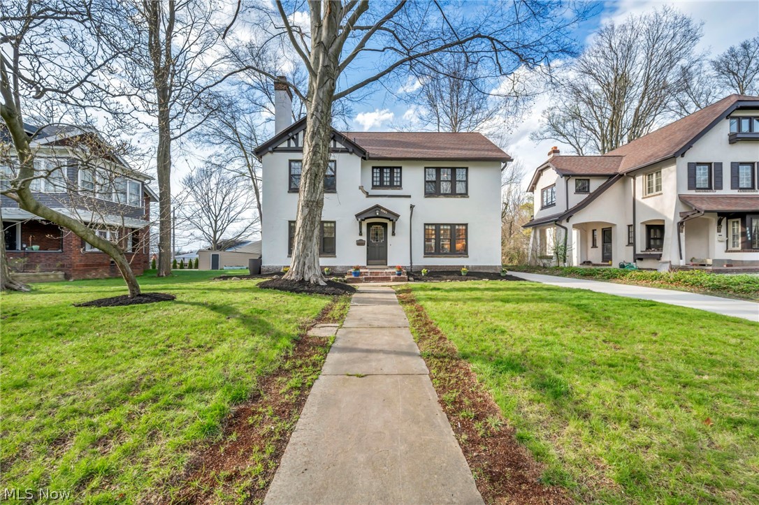 Timeless architecture paired with modern updates defines this distinctive home, rich in character and classic detail. Set in a prime Cleveland Heights location, the property offers convenient access to Coventry Village, Cleveland Clinic, University Hospitals, University Circle, Little Italy, and Case Western Reserve University, along with the area’s renowned dining, shopping, and cultural destinations as well as year-round community events.
Extensively updated with available comprehensive improvement list that includes both visible enhancements and major mechanical upgrades: plumbing, electrical, hot water tank, HVAC modernization, waterproofing, driveway, and more—offering true peace of mind. Striking curb appeal with front and rear outdoor space, elevated on a gentle rise that enhances presence and setting.

Thoughtful design throughout. Inviting rear porch provides a perfect setting for morning coffee. Spacious owner’s suite features a private en suite bath. The redesigned kitchen showcases intentional updates, blending function and style. Third-floor bonus level offers flexible use for studio, recreation, workspace, or fitness. Lower level is clean, bright, and well-maintained with additional usable space.

Point of sale violation free. Floor plan details available within the photo set.  ~A truly one-of-a-kind offering, blending distinctive character, thoughtful updates, and an unmatched location~