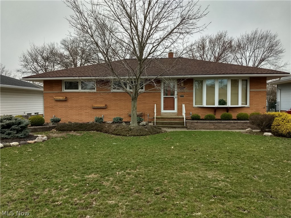 You'll love this house! Endless possibilities here! Charming Brick ranch with three bedrooms, one full bath and half bath along with a stand up shower in the finished basement.  Huge bay window in the living room allowing extra sun light, separate dinning room, & nicely sized kitchen with super cute built in table & bench seating. All three bedrooms are very spacious and have nicely sized windows. Enjoy your summer nights in the "4 season" spacious enclosed back porch. Fully finished basement with kitchenette, family room, laundry room, extra storage area, stand up shower, & built in cabinets. All of this plus there's a deck, shed, built in gas grill, and two car garage that comes with refrigerator, built-in cabinets for a possible workshop, ceiling fan, & electric door opener. WOW! Great family neighborhood with park & playground down the street and close to all conveniences. This house is truly special! Call today to request a showing!!