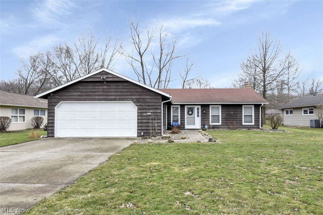 Wow...this Move-in ready and beautifully updated charming 3-bedroom, 2 full bath ranch offers comfort, style, and convenience all in one. Step inside to find new flooring, fresh paint throughout, and modern lighting that create a bright and welcoming atmosphere. The bedrooms feature newer carpet, providing a cozy retreat, while the remodeled bathrooms add a touch of contemporary elegance. The spacious layout flows effortlessly for everyday living and entertaining. The kitchen comes fully equipped with all newer appliances that stay, updated cabinets & counter-tops, making your move even easier. You will love this cozy fireplace overlooking the spacious living space! Out back, enjoy your own private outdoor oasis with a concrete patio just off the house—perfect for entertaining or relaxing around the fire pit. The backyard also includes a shed for additional storage and plenty of green space to enjoy outdoor activities. Additional updates include an updated hot water tank for added peace of mind. As a bonus, a community pool is within walking distance, giving you a great place to cool off and socialize during the warmer months. This well-maintained ranch truly combines modern updates, functional living space, and great outdoor amenities—ready for you to move right in and call home.