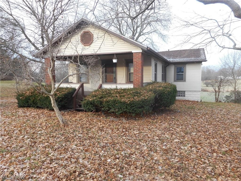 Quaint 3 bedroom ranch sits on nearly 1/2 acre lot and is affordable.  Plenty of kitchen cabinet storage and offers a grand view of the private, backyard.   Whether you enjoy the backyard deck or front porch swing next spring and summer, you will enjoy the seasons.  Walk out unfinished basement.  Great beginner home or investment opportunity.  New roof - 2017.