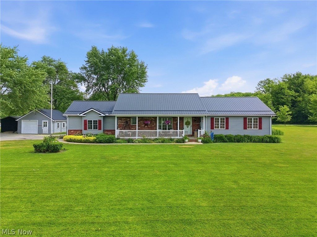 Welcome home to this beautifully maintained 3-bedroom, 2-bath ranch situated on 1.946 peaceful acres in highly desirable Jefferson! Built in 2004 and thoughtfully updated throughout, this move-in ready home offers the perfect combination of comfort, functionality, and country living.

Recent improvements include a durable metal roof, central air, carpet and flooring, appliances, sump pump, garage doors, covered rear deck, leaf guards, Ember fireplace, custom window fixtures, dog wash bay, and much more! The spacious primary suite and convenient first-floor laundry make everyday living easy, while the inviting layout offers plenty of room for entertaining and relaxing.

The finished lower level provides additional living space, abundant storage with built-in shelving, and fireplace hookups, with additional hookups located in the living room, primary bedroom, and foyer for future customization. Enjoy peace of mind with a whole-home water filtration system featuring iodine filtration, a salt softener, and reverse osmosis at the kitchen sink and refrigerator. An extra backup battery for sump pump adds another layer of protection and peace of mind during power outages.

Outside, you'll love the fully fenced backyard, perfect for pets, kids, or outdoor entertaining. Unwind on the newer covered deck and soak in the included one-year-old jacuzzi while overlooking your private backyard oasis.

The property also features a 2-car attached garage, a detached 1-car garage with storage, carport, and two storage sheds, providing plenty of space for vehicles, tools, hobbies, and outdoor equipment.

All appliances stay, making this truly a turnkey opportunity. If you've been searching for a well-maintained ranch with acreage, modern updates, and exceptional storage in sought-after Jefferson, this is one you won't want to miss!