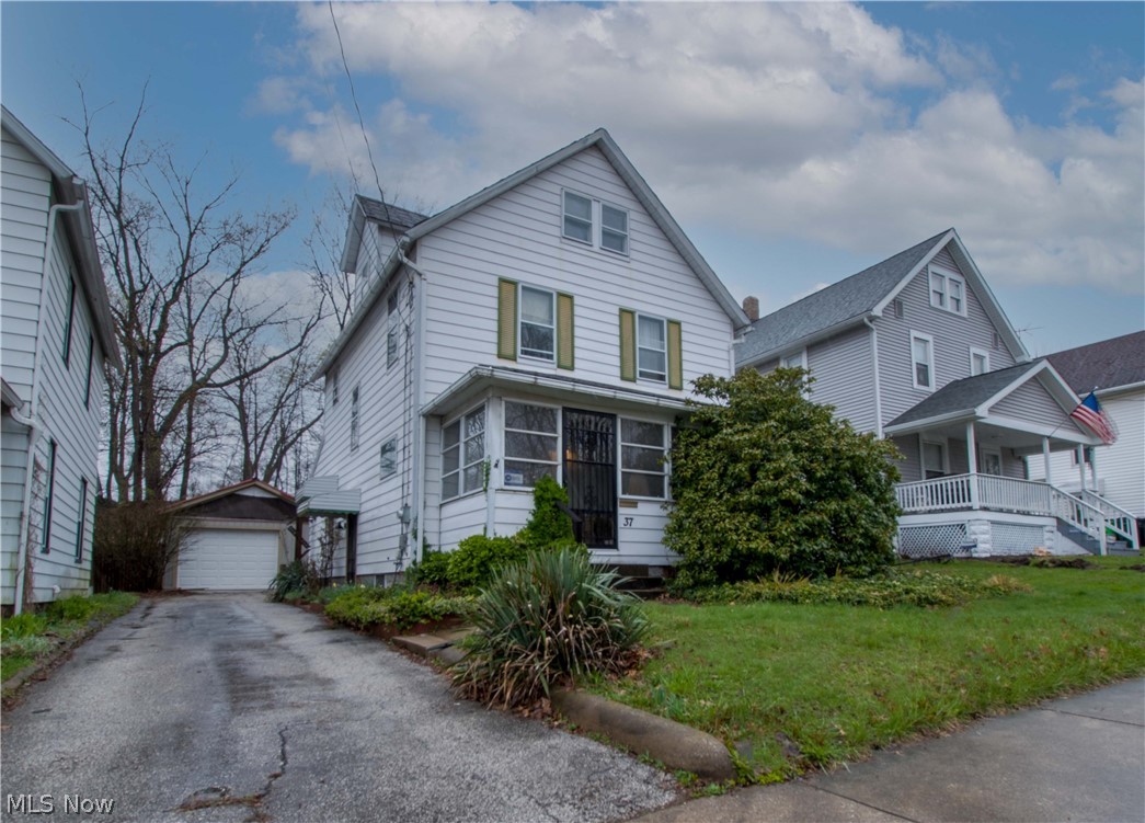 Four bedrooms, 2.5-story Colonial home in the City Of Barberton. Original woodwork & wood flooring --enclosed front porch (19 x 7). Nice size eat-in kitchen with french doors leads to the brick patio and private backyard—First-floor bath with a walk-in shower and stackable washer & dryer hookup. The second floor offers three bedrooms and a spacious full bathroom, and the finished attic is the 4th bedroom with built-in shelves and a large walk-in closet. The full basement has glass block windows and a 2nd laundry hookup with a utility sink. Make an appointment for your private showing today!