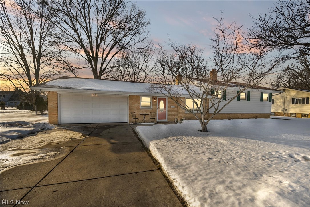 Wonderful property in Westlake! This split level has a wonderful floor plan. Updated flooring throughout. Enter into the tiled foyer.  The kitchen has updated cabinets, newer appliances, and an eat-in area.  Large dining room/living room combination with vaulted ceilings. The living room has a large fireplace with surrounding built-ins. Large sliding doors lead you to the renovated sunroom where you will enjoy entertaining family and friends. The sunroom has garage doors on three sides, it has heat and air-conditioning; you will love this design! An updated, half bath finishes up the first floor. The second floor includes the 3 bedrooms and an updated full bath. The large master bedroom with a deep California-style closet. The basement is finished with LVP flooring and a warm and cozy fireplace; a barn door leads to the utilities and laundry area. The 2 car attached garage is deep with vaulted ceilings, plenty of storage room. The backyard is large and fenced in. Come see for yourself!