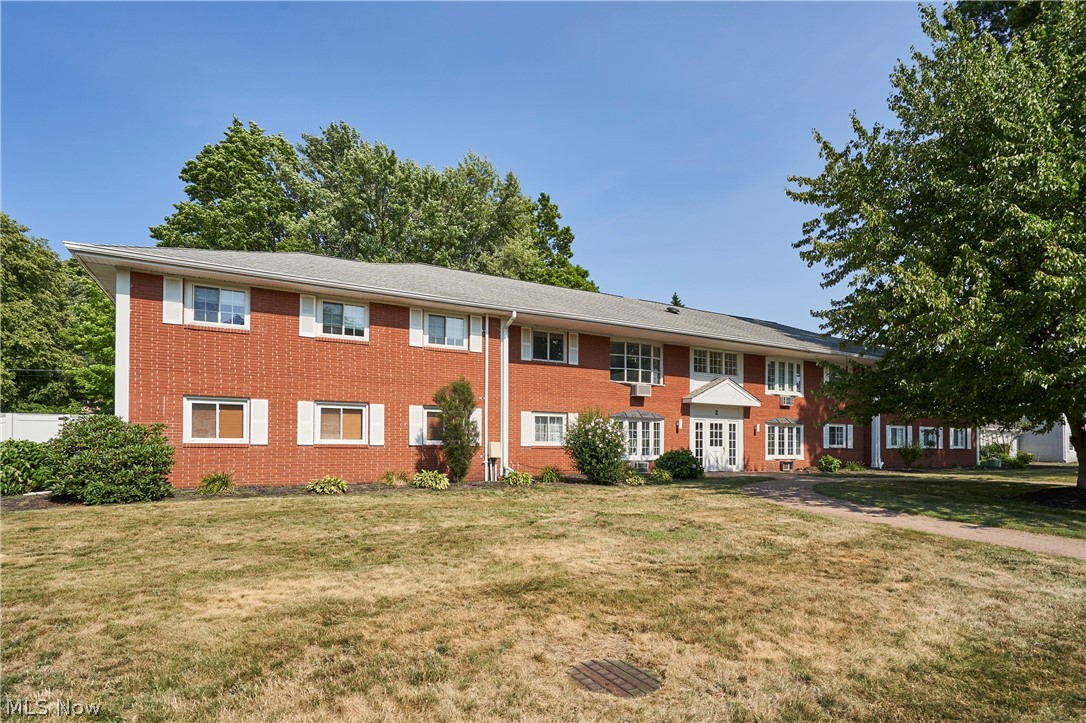 This beautifully maintained 2-bedroom, 1-bath first-floor condo offers style and convenience in one package. 1 car detached garage. Enjoy elegant hardwood flooring in the living room, dining room and 1 bedroom, an updated full bath with double vanities, and a welcoming, floor to ceiling brick, wood burning fireplace that anchors the living space. With its move-in ready condition, this home is ideal for buyers seeking comfort and low-maintenance living. Home warranty included for added peace of mind.