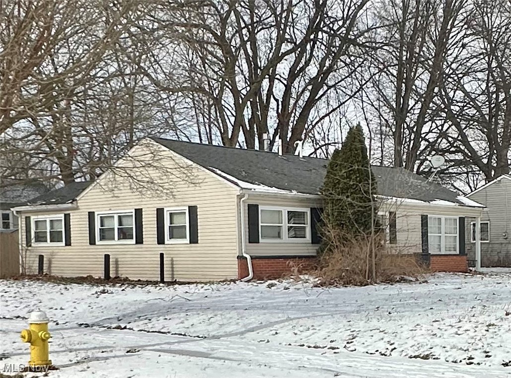 Situated on a spacious corner lot, this charming West Akron ranch is the opportunity you've been waiting for. Updated vinyl siding, windows and roof. Beautiful gray kitchen with sleek black countertops and gorgeous luxury vinyl flooring throughout the entire main level. The Dining area is open to a spacious Living Room. The 4th bedroom wall has been opened to create an additional Family Room! There's an attached garage plus a private fenced backyard with beautiful shade trees. Great location with tree lined streets and sidewalks. Won't last!