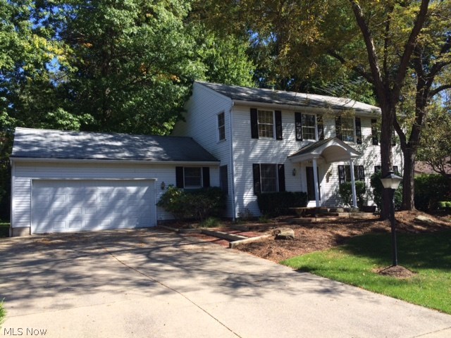 Lovely Colonial 2 Story featuring an Oak kitchen with hardwood floors.  Family room with a brick accented fireplace w/gas logs.  Great Sunroom w/walls of windows to enjoy the park-like private wooded backyard.  First floor laundry large enough to also be a mud room.  Shed also provides great storage.  Freshly painted!  Schedule a showing soon.