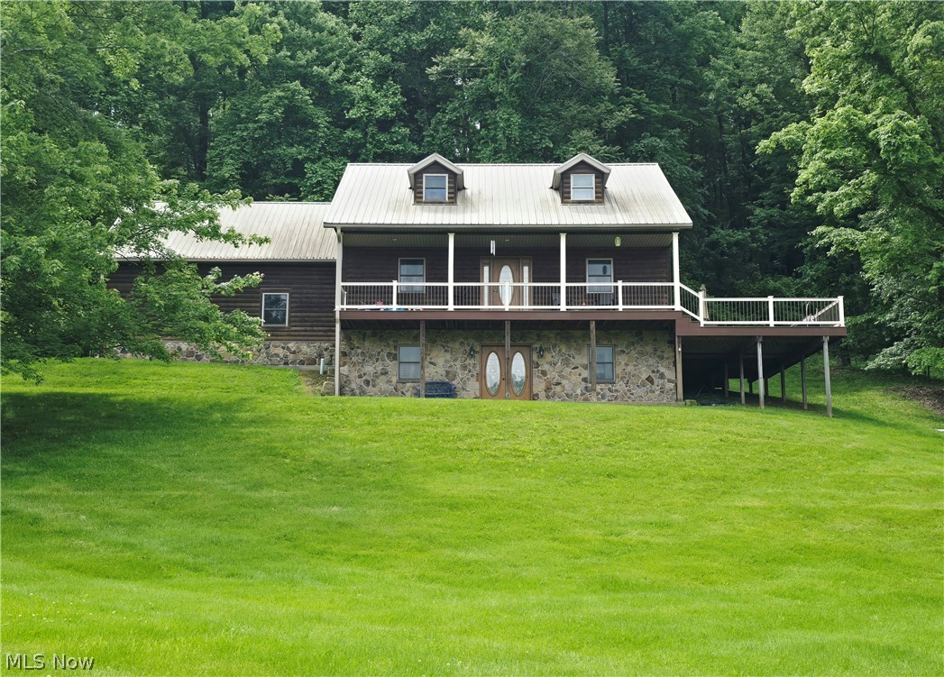 Stunning home situated on 3.5 acres, offering space, functionality, and versatility! The main level features a large open kitchen with beautiful hickory cabinets, sitting room, dining space, laundry room, and a convenient half bathroom. The primary suite is also located on the main floor and includes a huge walk-in closet and full bathroom with walk-in shower. Upstairs, you’ll find two bedrooms, one large bonus room, and an additional full bathroom with jetted tub. The finished walk-out basement has a beautiful nature stone entryway and offers a cozy family room with fireplace, finished bonus room, and a third full bathroom with walk-in shower. The large wraparound deck is perfect for relaxing and entertaining. This home also features an attached two-car garage, impressive 30x50 detached garage with space for up to four vehicles, and a whole house generator. Don't miss the chance to call this beautiful home yours. Call today for a private tour!