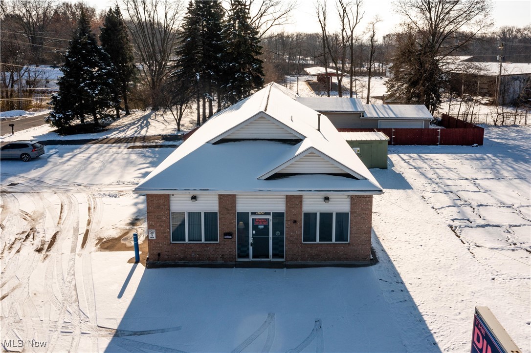 AMAZING COMMERCIAL OPPORTUNITY situated on one of Lorain County's most traveled roadways! PER ODOT traffic data, daily counts exceed 12k! Zoned GB (General Business), great for intended use as automotive shop or would make a great space for a construction related company. Located less than 10 minutes from the I-90/57 and RT2/Middle Ridge exits as well as the Ohio Turnpike.  Elyria Township location provides a convenient radius to Lorain, Elyria, Sheffield, Avon and Amherst! This site is located on a corner lot for maximum visibility, concrete parking lot. Two parcels. The commercial building was professionally built and designed in 2002 and  consists of aprox. 2500+ sq ft., garage has four bays with a ceiling height of about 12+ft! Spray booth with exhaust system. Two ADA compliant bathrooms (one for employees and one in the lobby)! Attractive and spacious air conditioned lobby with reception counter. Private office area. Great exterior appeal with brick front and a concrete parking lot. There is additional small space for outdoor storage behind the shop. One owner on the commercial portion, well maintained and has been used as the same business for over 20 years!