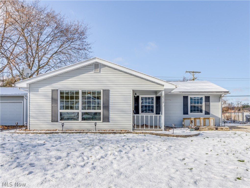 Welcome to this beautiful ranch, tucked away in the Heslop neighborhood, in the city of Cuyahoga Falls! As you come to the property you will notice all new hardscape that was completed in the summer of 2021 for easy maintenance! You will have a fully fenced in backyard that has a gate to access Kennedy Park directly behind it, to enjoy anytime of the year! You are also less than 5 minutes from Water Works Park! As you are admiring the fenced in back yard & patio  make your way over to the 2-car detached garage with its own electrical panel. Once you are completed outside, make your way through the front door and admire the living area & dining room that has great big windows to let all the natural light in. As you make your way down the hall you will notice all the beautiful original hardwood floors throughout, the 3 bedrooms, one full bathroom and ample closet spaces! Off of the dining room, you will notice a nice eat in kitchen with ample counter space and cupboards. All appliances a