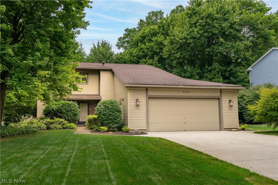 Welcome to 322 Great Oaks Trail, where distinctive contemporary architecture meets decades of exceptional care. Offered for the first time in over 40 years, this two-owner home has been lovingly maintained since 1984 and is ready to welcome its next chapter.

Inside, you'll find over 2,700 square feet of finished living space featuring 3 bedrooms, 2.5 bathrooms, soaring ceilings, and architectural details that make this home truly memorable. The dramatic two-story dining room creates an impressive first impression, while the open staircase and second-floor overlook add character and an abundance of natural light throughout the home. Two fireplaces anchor inviting living spaces that were designed for both everyday comfort and entertaining.

The spacious kitchen offers generous cabinetry, a center island, stainless steel appliances that convey with the home, and convenient main-level laundry just steps away. An additional 350 square feet of finished lower-level living space provides the perfect flex area for a family room, home office, recreation room, or hobby space.

Step outside and discover your own private backyard retreat. Enjoy peaceful mornings in the screened Florida room, relax beside the tranquil koi pond and fountain, entertain on the expansive paver patio, or unwind on the private balcony off the primary suite overlooking the beautifully landscaped backyard. Surrounded by mature trees, the outdoor living spaces offer a level of privacy that's increasingly hard to find.

Situated on a beautifully landscaped 0.37-acre lot in Wadsworth City Schools, this home also features a two-car attached garage and is just minutes from shopping, restaurants, parks, and everyday conveniences. Homes with this level of architectural character, thoughtful design, and decades of meticulous ownership rarely become available. Come experience everything 322 Great Oaks Trail has to offer.