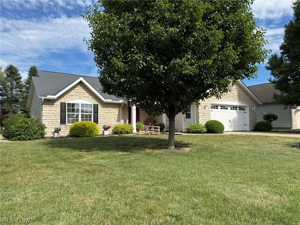 Like new-beautifully maintained 2 bedroom, 2.5 bath stone and vinyl ranch home.  Handicap accessible features with 36" wide doorways throughout.  Spacious ceramic tiled entry foyer welcomes you into this move in ready home.  Open floor plan with vaulted ceilings and gas fireplace in the living room.  Schrock cherry kitchen features an island breakfast bar and corner pantry.  Kitchen appliances included and were all updated in the last 5+/- years.  Cathedral ceilings in the bright and cheery sun room which provides access to the 20 X 16 rear patio and fence enclosed rear yard.  Large master suite boasts pocket doors to the walk in closet and full bath with walk in shower.  Walk in closet in the guest bedroom.  Main floor laundry includes built in cabinetry and utility sink.  Washer and dryer both new in 2024+/-.  2 car attached garage features new overhead door and garage door opener, both updated in 2026+/-.  New roof in 2020+/-.  New HVAC system in 2026.  Well insulated home helping keep utility costs low.  Current owner pays $84 for gas and $155 for electric monthly.  Rear porch swing stays.
