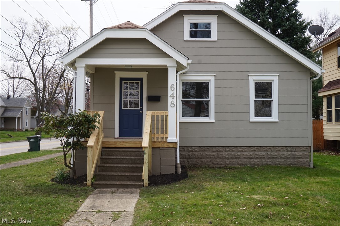 This charming bungalow has been newly remodeled and features an open-concept layout. The beautiful kitchen has a crisp, clean feel with granite counter tops, subway tile back splash, stainless steel gas stove with matching hood & refrigerator, and a raised breakfast bar. Living room & dining room have been tastefully painted and offer new luxury vinyl tile that extends into the 2 bedrooms on the main floor. The bathroom is complete with tile surround, new vanity, and a shiplap accent wall.  Upstairs you'll find a spacious 3rd bedroom with new carpet & large closet. The outdoor patio is the perfect place for grilling and has a walkway that leads to a partially fenced backyard. Call today to schedule your private showing!