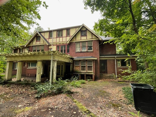 Built in 1912 by M.S. Long and designed by renowned architects Hagloch & Potter, this once-stately residence is ready for new owners to complete its renovation and restore its historic grandeur. Steeped in history, the home was later owned by Murray Parker—a cowboy, grocer, lawyer, legislator, commissioner, and restauranteur. The first floor showcases original red oak woodwork, fireplaces in both the living and dining rooms, pocket and French doors, and a striking carved staircase. The study was converted to a bedroom with full bath, and additional gathering spaces include a bright east-facing sun porch and a cozy den. The kitchen has been fully gutted, awaiting your custom design. Upstairs, you’ll find red gum (eucalyptus) floors, a large owner’s suite with fireplace, a secondary ensuite, another bedroom with attached sun porch, plus a family bath, cedar closet, and maid’s closet (perfect for future laundry). The third floor offers two bedrooms, a bath, a spacious bonus room, and a linen room with built-ins. The property spans 1.65 acres in a secluded neighborhood near Wallhaven and Highland Square. Seven garages provide ample storage, including two with a roughed-in carriage apartment above. This historic home offers extraordinary potential—bring your vision and make it your own.