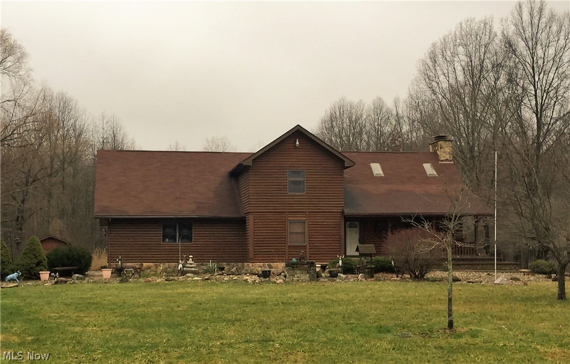 What a find! This unique 3-4 bedroom, 3 bath two-story log home boasts vaulted ceilings, hand cut stone walls, skylights and a terrific great room with stone fireplace.  Additional first-floor highlights include spacious kitchen, dining area, den/office (which could be used as a bedroom) and full bathroom with jetted tub. The second floor offers three bedrooms including the master which has an attached bath with hot tub. The basement has a rec room with fireplace, laundry area and workroom. Other highlights include covered porch, landscape pond, nice storage shed and beautiful acres of land.