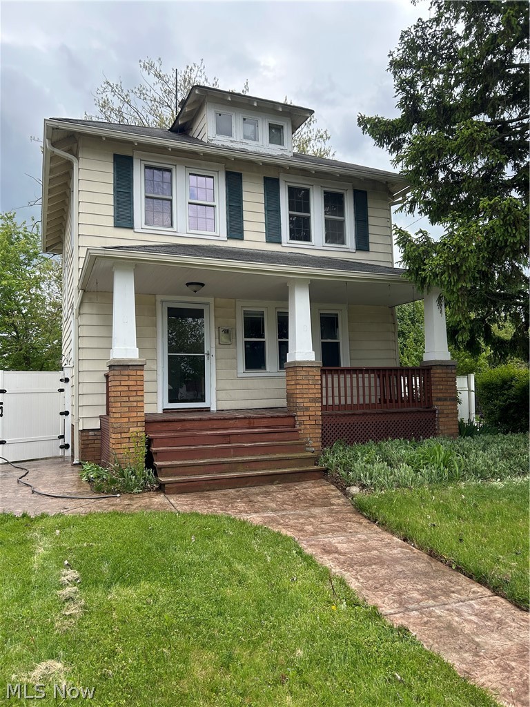 A must see Classic Parma colonial. Thoughtful, modern updates while retaining the charm of a century home. From the spacious front porch enter into living room with beautiful, gleaming, refinished original hardwood floors which are also found in dining room, staircase, hallway and all bedrooms. Living room features a fireplace with original brass light sconces above the mantel. Entire home retains all original trim and interior doors. Living room leads to formal dining room which has sliding patio doors to deck. Kitchen is all newer: cabinets, stone counters, a farmhouse sink and glass tile backsplash. All appliances remain with home. Upstairs are 3 good size bedrooms for an older home. Furnace 4 years old, hot water tank 2 years old. All vinyl replacement windows and newer exterior doors. Extensive electrical upgrades as well. Backyard completely fenced with vinyl privacy fence. Oversize 2 car garage with covered patio.