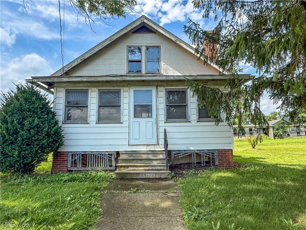 Located on an extra large lot with acreage, 10595 Forty Corners offers a rare opportunity for buyers looking for space, functionality, and long term potential. This 3 bedroom, 1 bathroom home features original hardwood flooring, a spacious kitchen, and a three season front porch that adds additional living space and a welcoming entry to the home. The property will require TLC and is ideal for buyers ready to renovate and build equity.

Outside is where this property truly stands out. A large, newer garage outbuilding with tall ceilings and double garage doors provides excellent space for vehicles, equipment, or workshop use. Additional outbuildings include a horse barn and chicken coop, both in need of repair but offering great potential for hobby farming or storage.

The home is serviced by propane heat, a private well, and a septic system, with both the septic and furnace being newer major improvements. With generous acreage, multiple outbuildings, and room to grow, this property presents a unique opportunity for buyers seeking land, flexibility, and future potential.