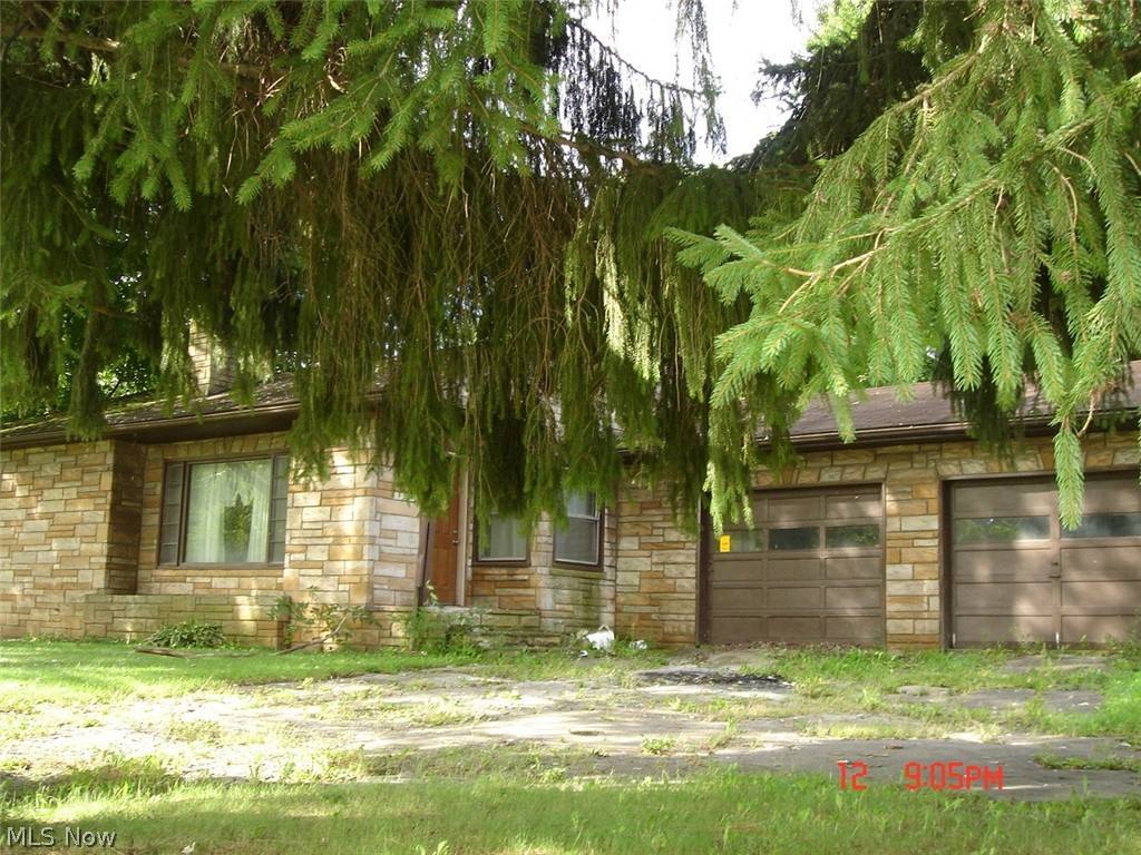 Three bedroom, one bath ranch with 2 car attached garage on the outskirts of town.  Being sold "as is".