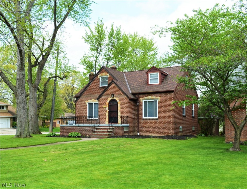 Timeless beauty and modern convenience can both be found in this completely remodeled brick home in Fairview Park.   Feel welcomed as you step onto the inviting front porch and notice the handsome brick exterior with sandstone accents.   Enter inside the front door into the large living room with a fireplace where you'll begin to take note of the new windows, refinished hardwood floors, crisp white trim, and neutral decor throughout the home.   The updated living room opens to an eat-in-kitchen with new soft close cabinetry, gorgeous granite countertops, stainless appliances, glass backsplash and ceramic flooring. The two main floor bedrooms both feature hardwood floors, new fixtures and new 6 paneled doors.  The new full bath has an attractive vanity with soft close drawers, new ceramic flooring, and new tile work around the tub and vanity.  Upstairs is a huge master retreat, with ample closet space and privacy.  Downstairs (not included in square footage) you'll find the bright famil