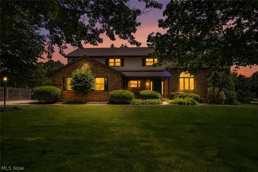 Beautiful curb appeal, a covered front porch, and a spacious layout define this former Parade of Homes Colonial in Lakeland Hills. Offering 4 bedrooms, 2.5 baths, over 2,600 square feet, and an oversized 2-car garage, this home has been freshly painted throughout with new carpet and updated lighting. The foyer opens into the impressive two-story great room, where soaring vaulted ceilings, a skylight, and a gas fireplace create a bright and inviting gathering space. Doors from the great room lead directly to the expansive two-tier deck, allowing the indoor and outdoor living areas to flow together with ease.

Just beyond, the bright eat-in kitchen offers new cabinetry, select stainless steel appliances, floating shelves, and a pantry. A sunny dining area is surrounded by bay windows overlooking the backyard. Off the kitchen, a separate family room provides valuable flexibility could be a den, playroom, or home office. A newly renovated half bath and first-floor laundry/mudroom with a convenient backpack rack complete the main level.

Upstairs, the open hallway overlooks the great room and leads to four bedrooms with generous closet space. The spacious primary suite features new flooring, a cathedral ceiling, walk-in closet, and private bath with a new tub and shower combination with tiled surround, and a separate toilet area. Three additional bedrooms share a remodeled full hall bathroom.

The full unfinished basement offers abundant storage and plenty of potential for future living space, along with a sump pump and additional laundry hookups. Outside, mature trees frame the nicely sized .41-acre lot, while the two-tier deck features new vinyl deck boards and freshly painted railings, creating an ideal setting for relaxing or entertaining. Conveniently located near Lake Cable, shopping, dining, and everyday amenities, this spacious Jackson Township home offers an exceptional combination of character, updates, and room to grow!
