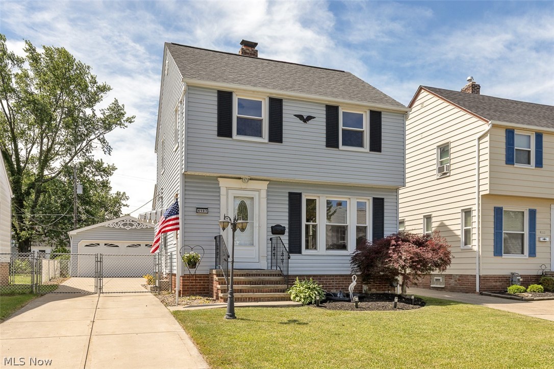 Welcome home to this beautifully maintained and updated 3-bedroom colonial featuring quality improvements throughout! Major updates include a complete tear-off roof (2019), HVAC system (2017), hot water tank (2014), vinyl siding, replacement windows throughout most of the home, and a newer 20' x 23' garage with a brand-new Genie garage door opener. Step inside to find fresh paint throughout, refinished hardwood floors on the second level, and attractive vinyl plank flooring on the main floor. The spacious living room offers a bright and welcoming atmosphere, while the dining room features a crystal chandelier, newer patio doors, and access to a covered 13' x 11' veranda with vinyl decking and a ceiling fan—perfect for outdoor entertaining. The kitchen offers abundant oak cabinetry, a large pantry, double stainless-steel sink with pull-out faucet, updated lighting, and all appliances. Upstairs, an oak staircase with ornamental iron railing leads to three nicely sized bedrooms with refinished hardwood floors and ceiling fans. The full bath features a vinyl tub surround and oak storage cabinet. The finished lower level includes a recreation room plus a large utility/laundry area with front-load washer and dryer. Additional features include central air, Aprilaire humidifier, glass block windows with vents, and annual HVAC maintenance. Outside, enjoy the extra-wide concrete driveway, koi pond, and premium 6-person hot tub. The detached garage includes a workbench, cabinets, lawn mower, and snow blower. Lovingly cared for by the same family for 42 years, this move-in ready home includes a 1-year home warranty and offers comfort, convenience, and exceptional value throughout!