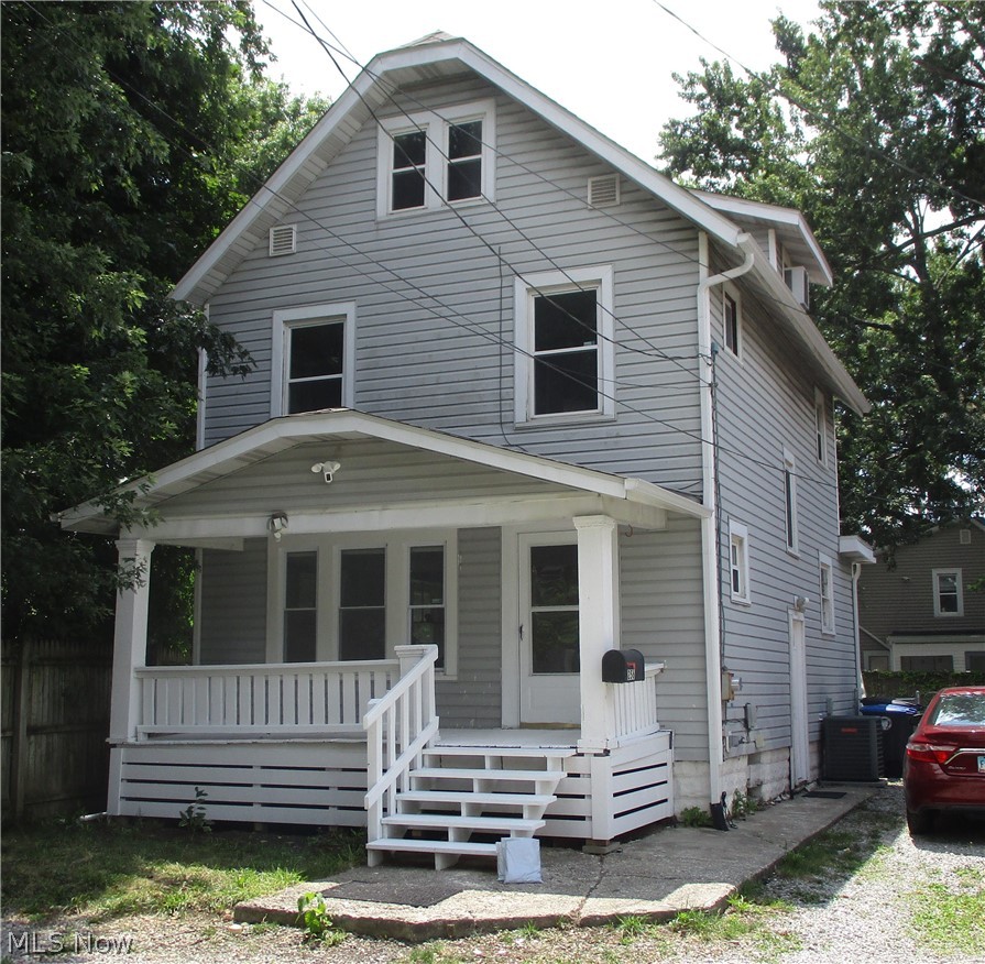 Welcome to 256 Sues Ct!  This spacious century home near Akron U is full of  character and charm.  Sitting on a quiet private street with caring neighbors, it would make a great investment property or a single family residence.  Complete with tall ceilings and genuine wood floors, it has 3 bedrooms and 2 full baths, and a bonus 3rd floor attic space that can be used as a 4th bedroom.  The fenced in back yard has a charming brick patio that can be accessed from sliders off the kitchen.  A stackable washer and dryer off the kitchen allows for easy laundry access.  Updates include new roof and gutters in 2025, newer front door, some newer windows, hot water tank 2021, siding 2016. Electric panel 2021. New water line to the road, 2018. Strong mechanicals including central air.  Recently reinforced and painted front and back steps.  Schedule your showing today!
