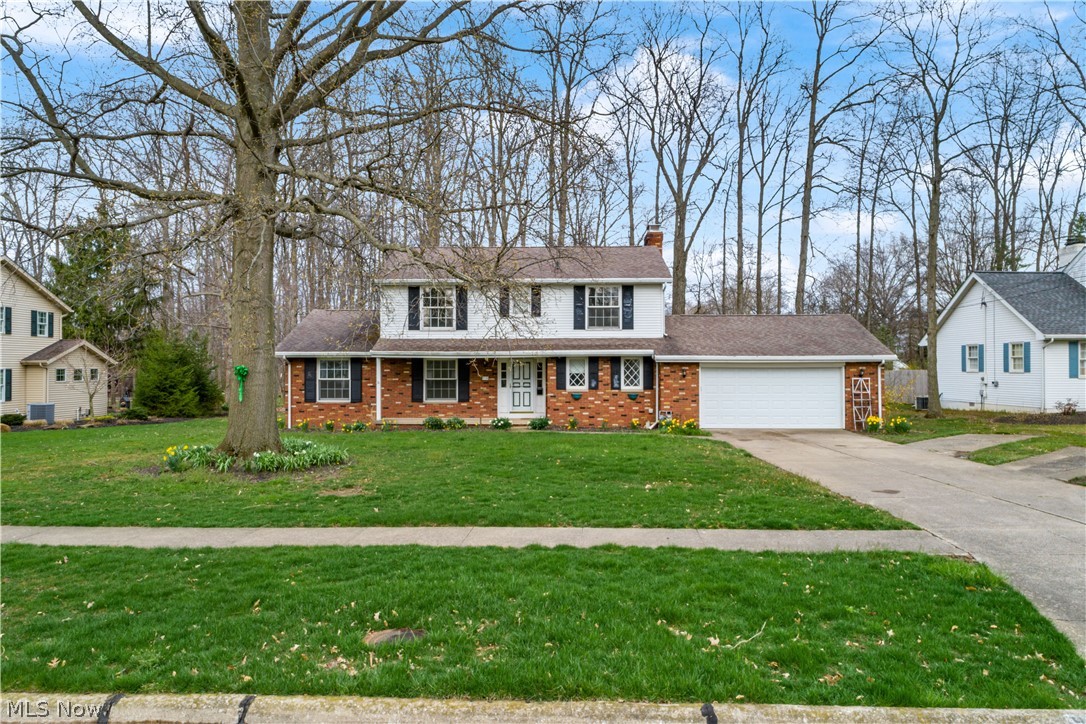 4 BR 2.5 BA, 2202 sq ft brick-front center hall Colonial on beautiful cul-de-sac street in Forest Meadows. Covered front porch, full unfinished basement plus large crawl-space storage, wooded lot. Front door to open foyer with coat closet. Huge living room is open to the dining room with built-in corner cabinets. Kitchen with pantry and slider to rear patio and private wooded yard. Beautiful solid wood from staircase and spindled railing. Family room with built-in shelves and storage bench, closet, full masonry wood-burning fireplace with (removable) gas heater, and a sliding door to screened back patio with built-in brick indoor grill. Screened porch has newer metal roof and nice isenglass roll-up enclosure panels. Roof was replaced within the last 5 years and gutter guards installed. Recently professionally painted walls throughout the home. 1st floor laundry room with sink and storage closet. Garage has newer whisper-quiet wi-fi enabled opener and insulated vinyl door, and man-doors