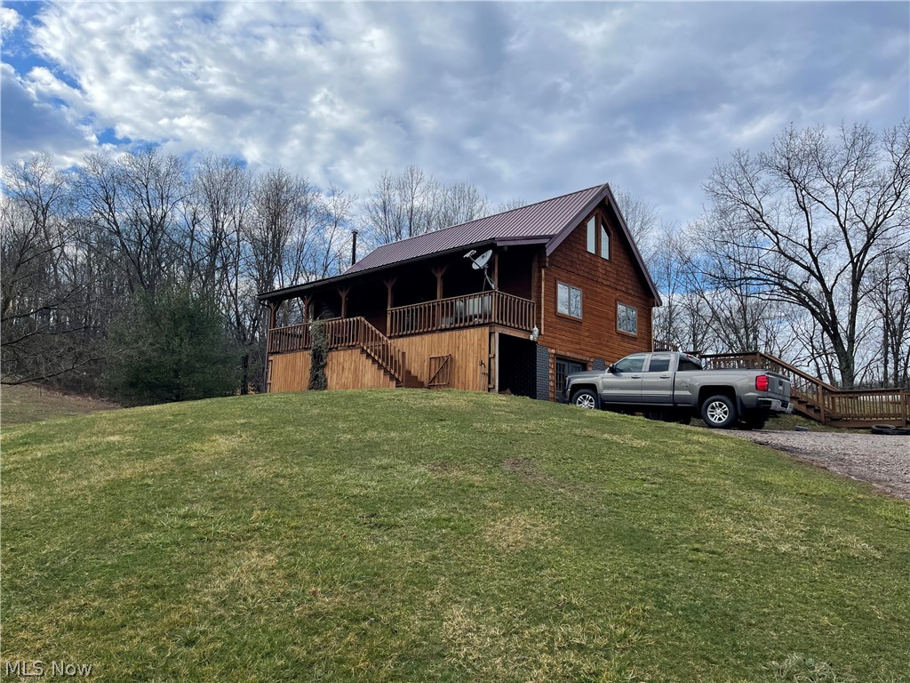 If are looking for privacy with convenience to SR 7 (1.5 miles) and US 33 (5.5 miles) You have found it here! This 3+ bed, 2 1/2 bath log home offers a Great room, dining area, kitchen, Bedroom and full bath (garden tub and separate shower) on main level. 2nd story offers a bedroom, half bath and lofted study area.  Lower level, walk out basement offers another tv/media room area, full bath, bedroom, office, storage and a laundry/utility room. Home has a two car detached garage. Rear deck, front porch. You can heat with a wood furnace, electric or propane! Home has central air, septic (aerator) Tuppers Plains water, and Windstream internet.