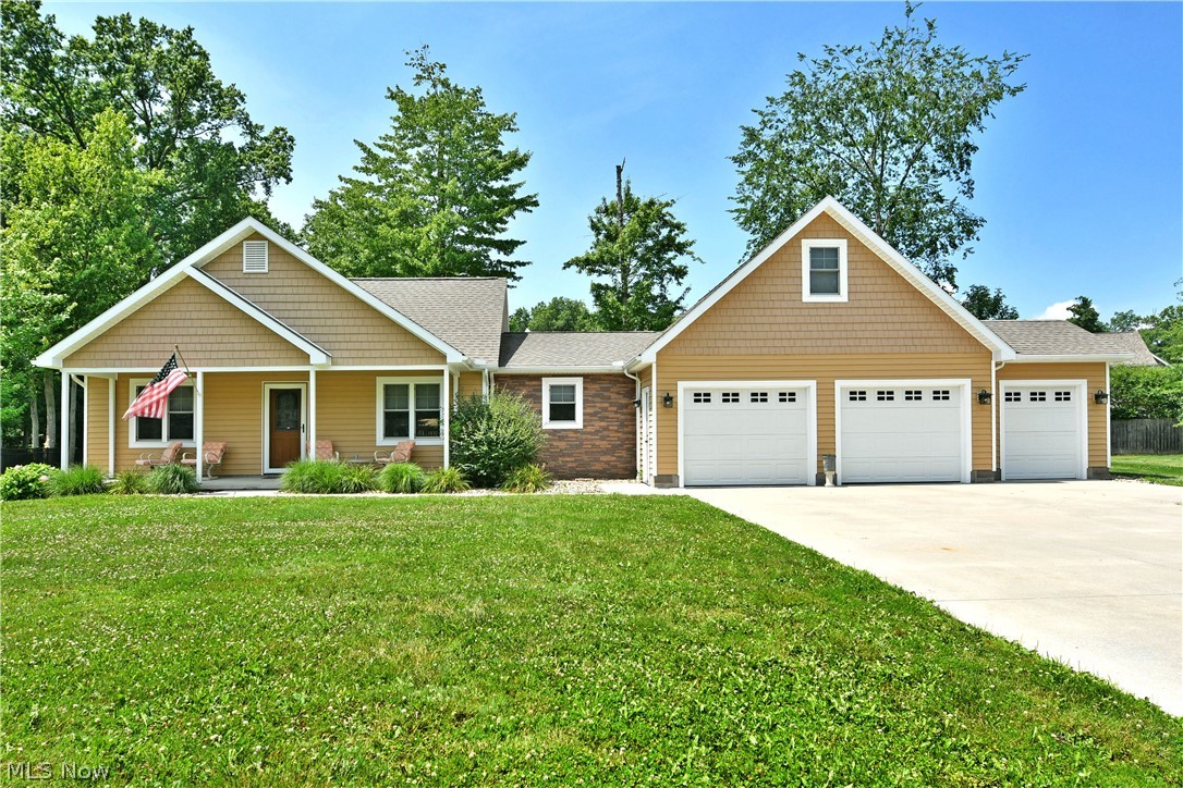 A true Cortland treasure, this custom designed and built home is just what you’ve been dreaming of! Nestled away along a cul-de-sac on a dead-end street, this home provides traffic free serenity while just moments from bustling downtown attractions and more. Commanding an instant presence, its outstretched ranch layout captivates with warm earth tones and bright white trim that outlines both the covered front patio area and a three-bay garage with a built-in shed. Handsome stone trim follows with the matching landscaping that leads you inside. Meanwhile, a darling rear patio takes advantage of its ample cement pad and large bushes for natural privacy. An elegantly appointed front door opens to the brightly lit foyer, finding a guest bedroom or easy home office just behind the sliding barn door. Hardwood style flooring runs underfoot, continuing into the adjacent dining area. The central living room wows with its generous footprint, carpeted flooring and window-lined rear wall that introduces plenty of natural light. Patio access waits nearby. Down the side hall, an endearing full bath joins an additional corner bedroom with its large closet. Opposite the home, enjoy the impressively appointed kitchen and its advantageous center island. Decorative tiled flooring continues below. Around the corner, laundry serviced and utilities offset both garage access and the stairway to a finished second story attic; a great potential fourth bedroom. Completing the package, an oversized master suite enjoys a sunken, shelf window along with a walk-in closet, linen closet and stylish full private bath.