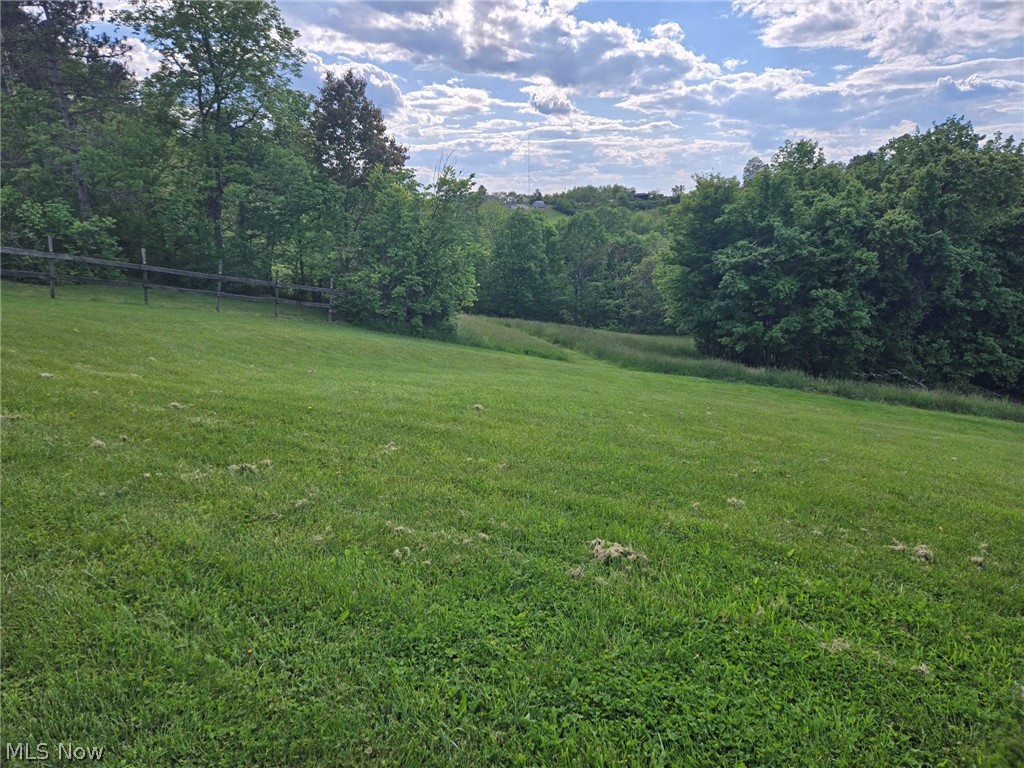 26 Acres of pasture, woods & privacy with 4 buildings and a pond. Experience the perfect blend of open space, natural beauty and total privacy on this 26 acre property located just minutes from town. With a mix of open pasture, mature woods, ATV trails and a lovely pond, this land is ideal for anyone seeking room to breathe, farm, hunt or simply escape. There are 4 buildings on the property including one with horse stalls. Several ideal spots for food plots to attract deer, turkey and other wildlife. Scenic pond perfect for fishing, wildlife or relaxing by the water. This land offers the rare combination of usable pasture, healthy woods and water, making it a standout for buyers seeking versatility. Whether you want a horse property, a hunting retreat, a mini farm or a recreational getaway, the infrastructure and natural layout are already in place.

2025 Kioti Tractor, Brush Hog & Loader, 2015 Yamaha Viking and John Deere Zero Turn Tractor can be purchased separately.
