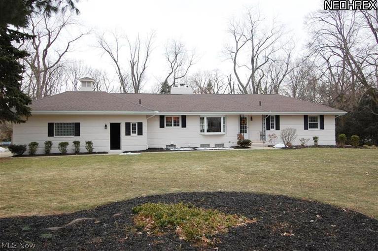 True gem in Fairlawn Heights!  This remarkable ranch has been totally updated from head to toe, offers a 4 car garage & 1.3 acres with an outbuilding that's more like an entertainment center!  All updates are as recent as October, 2013 & include:  an amazing kitchen with Kraftmaid maple cabinets/drawers, crown molding, pantry, stainless steel appliances, glass backsplash, granite counter tops, tile flooring & large eating area.  Redesigned master suite features 6 x 10 walk in closet, sitting area, & full bath with claw foot soaking tub, walk-in shower & double sinks.  Fabulous refinished hardwood floors accent the entryway, formal dining room & living room with woodburning fireplace.  Additional home improvements include the roof, chimney, electric, plumbing, 2nd full bath, carpeting, fresh paint & more.  Basement is spacious & clean.  Capture the beauty of this property from the expansive all season sunroom then step outside to enjoy the stamped concrete patio & gorgeous backyard.
