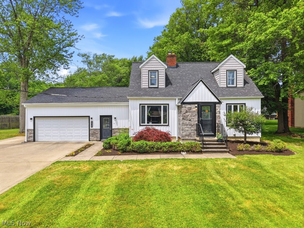 For the first time in over 25 years, this beautifully cared-for home is ready to welcome its next chapter. Thoughtfully updated through the years, it blends timeless warmth with modern comfort. A new roof, new siding, and a striking custom stone front create unforgettable curb appeal, while the backyard feels like a private park—complete with mature woods, a patio, lush garden beds, and an outdoor stone fireplace perfect for outdoor gatherings.

Inside, the home offers 5 spacious bedrooms and 4 full bathrooms, along with rich maple flooring that carries warmth throughout the main level. The kitchen features cherry cabinetry, abundant storage, and easy flow into the dining room with custom built-ins. A cozy wood-burning stone fireplace anchors the living room, creating a natural gathering space. Everyday convenience shines with a large first-floor laundry room, a mudroom off the attached 2-car garage, and an unfinished basement ideal for a workshop, gym, or future expansion. This is a home built for living, gathering, and growing—ready to be loved for decades to come.