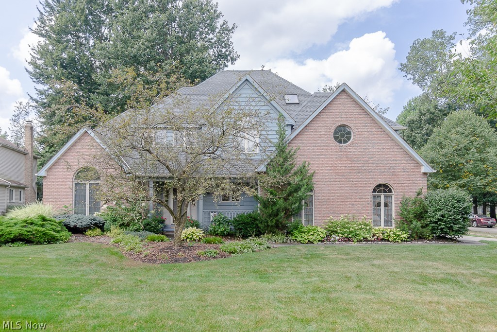 Magnificent, well maintained, updated custom-built modern colonial. Impressive open floor plan providing flow between the spacious airy rooms with tons of windows & natural light throughout. Located in a prime neighborhood with access to (480, 1-90, Ohio Turnpike) and shopping. A grand two-story foyer greets with a unique dual staircase allowing easy access from both the front and the rear of the home. The foyer opens up to a large vaulted ceiling living room connected to a formal dining room with a full wall bay window. The eat in kitchen features modern appliance, hardwood floors, granite countertops, and an island with seating and room for a full-size dining table. Plenty of storage with double door walk in pantry w/floor to ceiling shelving. The kitchen flows directly into a sunken family room w/woodburning fireplace. Large master with vaulted ceilings connected to a newly renovated bathroom with his/hers sinks. garden jacuzzi tub, walk in shower and two walk in closets. With three