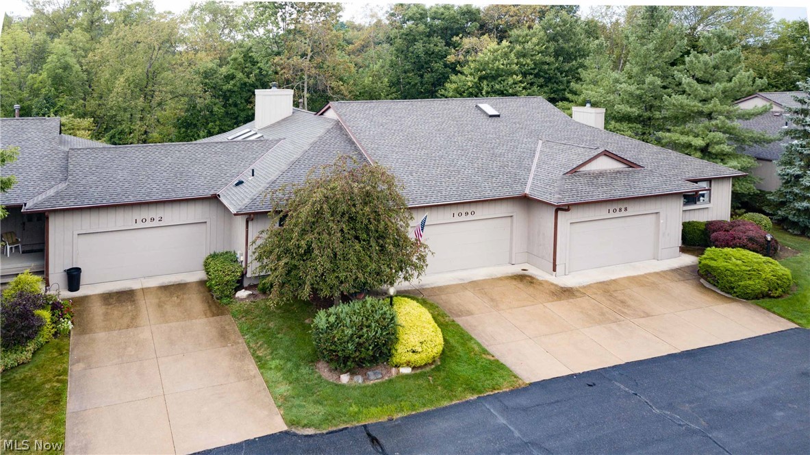 Amazing ranch condo in the Kanes - you can see the pool & clubhouse from the kitchen. Vaulted ceiling with 3 skylights & fireplace in living room with updated carpet. Sun room leads to sliding glass doors to deck overlooking private views & flower garden. 2 bedrooms, master suite has 2 wic, first floor laundry - washer and dryer remain. Kitchen - ceramic tile - granite counters - appliances remain. Full unfinished dry basement, roof replacement approximately 2012. Condo association cleans windows yearly, has club house & pool for  residents, deck has Akron awning retrackable awning.