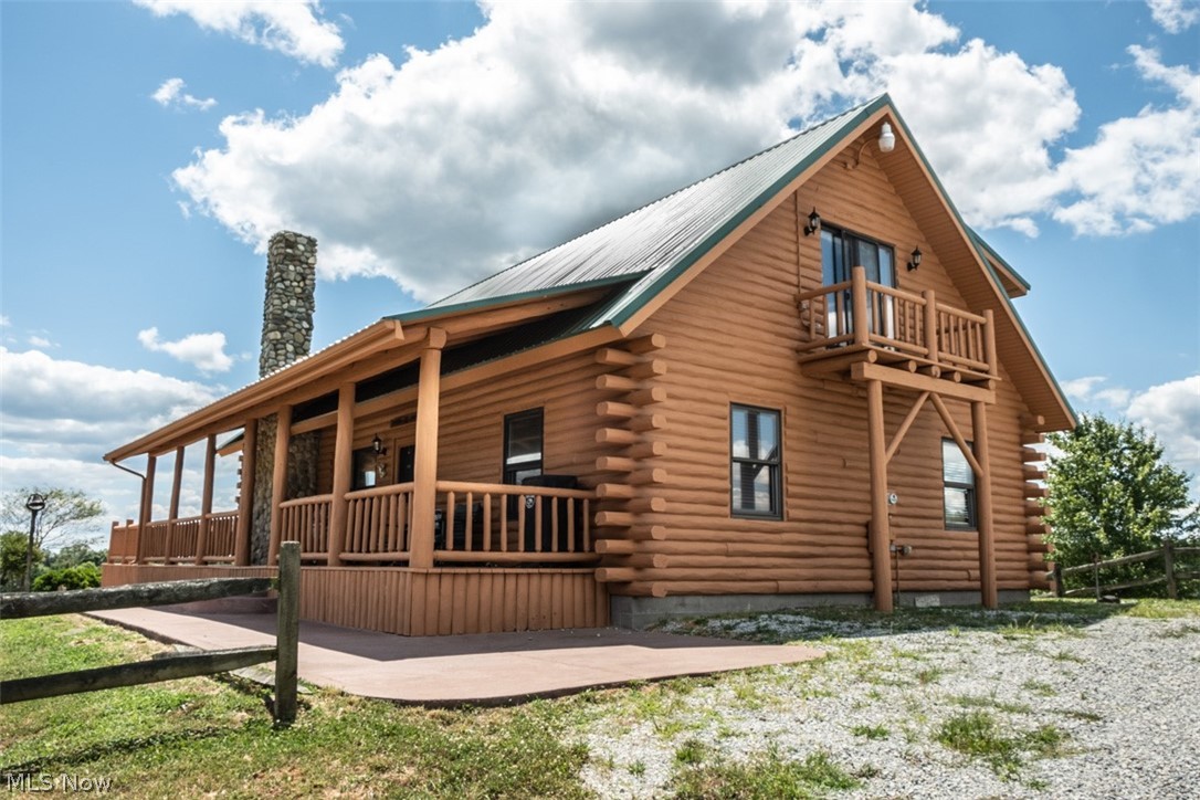 COME CLOSER!!! FEAST your eyes upon one of the MOST MAGNIFICENT properties to hit the market yet!!! Very private country estate with 266+ acres ... an outdoor paradise! This GORGEOUS LOG HOME and surroundings give the feeling of living in a world of your OWN! The LAVISH LOG CABIN features 3 bedrooms (one with a side balcony), 2 baths (one on each level), a BEAUTIFUL kitchen with an eat at bar, a LARGE BUT COZY great room with a stone wall fireplace, original log mantel, and cathedral log beamed ceilings!! The craftsmanship and quality here is SUPERB!! Let's OPEN either set of these GLASS DOUBLE DOORS and step onto the HUGE wrap around deck/patio with fire pit, that goes all the way to the front covered porch...Gazing out over the property you are absorbing the AMAZING VIEWS of the countryside! This home includes a detached 4 car garage, storage shed, a yard that is largely fenced in, and a 2 ACRE STOCKED POND for all those care free days of fishing! Also on the property approximately 1