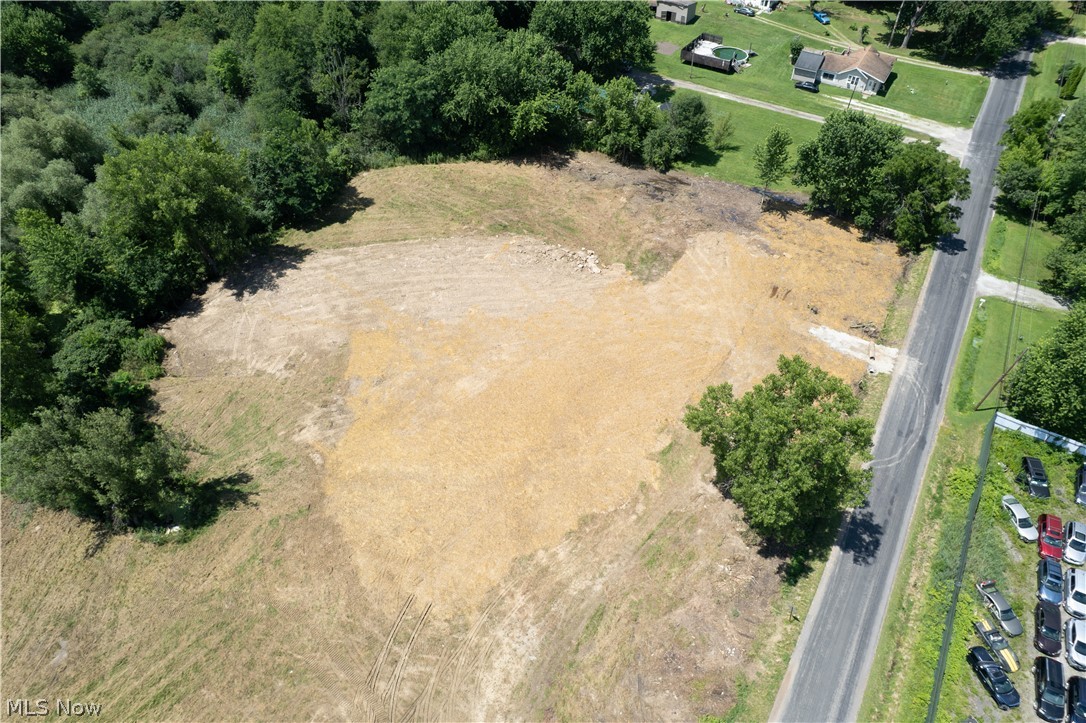Great opportunity to own two adjoining residential lots totaling 1.26 acres in Springfield Township. Located on Samuel Rd, this property offers an open setting with driveway access already in place and a natural tree-lined backdrop, as shown in the aerial photos. The lots include an existing well on the property, though serviceability is unknown.

The property is located on a route expected to receive city water and sewer service in the future. Soil sampling may be possible near the front or back of the lots, though deep digging with an excavator would be required. The rear of the property is surrounded by wetlands, so buyers should verify all building requirements, setbacks, utilities, soil/septic options, zoning, permits, and intended use with the township and proper authorities. Bring your vision and explore the potential this spacious land has to offer!