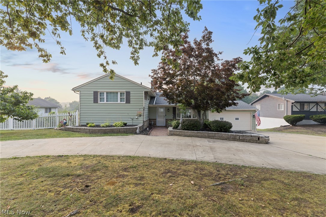 Welcome to this beautifully updated 4-level split located on nearly an acre in desirable South Mentor!  This 3-bedroom, 2 full bath home offers a spacious open-concept layout with the wall removed between the kitchen and main living area, creating the perfect space for entertaining.  The remodeled kitchen features modern updates, while additional improvements include new flooring throughout, remodeled main bathroom with updated plumbing, new hot water tank and exterior painted in 2020.  The lower levels provide exceptional living space with a family room and a walkout basement offering endless possibilities for a workout room, recreation space, home office, or additional gathering area.  The basement has been professionally waterproofed and includes a transferable lifetime warranty for added peace of mind.  Enjoy the outdoors on the new Trex deck off the kitchen with a new sliding glass door overlooking the private, tree-lined backyard featuring fruit trees and a garden area.  Additional highlights include a circular driveway, attached 2-car garage, and a peaceful setting close to parks, shopping, dining and major highways.  Schedule your showing today!!!