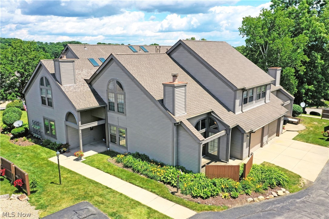 Embrace the perfect combination of style and convenience with this daring Canfield condo! Located in the heart of it all, this two-story charmer finds you right off Tippecanoe, all tucked away in a quiet development that puts you just moments away from the area's most desirable shopping and dining districts. Travel and commuting are a breeze with its quick access to major throughways and highway systems. The cozy corner location showcases its handsome exterior and generous single-car attached garage along with a private patio area for easy summertime relaxation. Through the front door, the stylish foyer finds a carpeted staircase, rising to the second-floor bedrooms. Meanwhile, an open central layout wows with its charismatic living room and towering mantle with its inset fireplace. Corner dining space is available along with bar-top seating at the kitchen for casual meals or additional guest seating. The functional layout delights with wood faced cabinets and recessed overhead lighting. Around the corner, a half bath is located along with laundry and garage access. Upstairs, the robust landing finds a welcoming family room with a loft overlook. The guest bedroom provides spacious quarters and a large closet, highlighting its arch topped window. An updated full bath is located steps away with its tall ceilings. Completing the package, an oversized master suite enjoys both its own full private bath and walk-in closet.