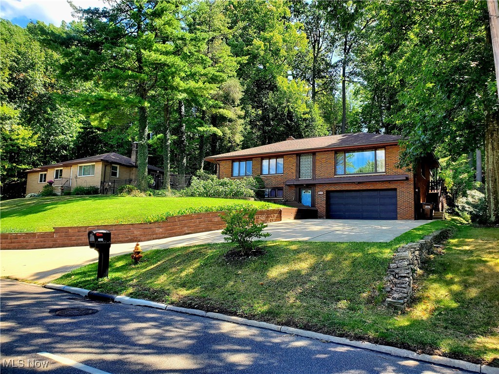 Welcome to this move-in ready lovingly maintained elevated ranch situated on the scenic road of West
Ridgewood drive. Offering 2,016sq. ft. of elegant living space. This home provides a harmonious blend of
classic charm and modern updates. Conveniently located minutes to I-77, with easy access to Parma
hospital, retail stores and dining just a mile down the road!
Inviting Living Spaces: The entrance foyer offers the option to a lower level family room with stone built
fireplace and full bathroom. Upon entering the top floor; Step into a gracious living room featuring beautiful natural light ,
hardwood natural floors, perfect for entertaining or just relaxing. The spacious living room boasts
gorgeous windows, with an adjacent dining area that accommodates a full-size dining room set
and leads to a sliding glass door that gives access to versatile Sun Room. The enclosed seasonal room
can double as your extended outdoor living area with a beautiful view of the outdoor flower garden
patio. The kitchen features natural wood cabinetry, wall fitted oven, cooktop with stainless steel range hood,
and ceramic flooring with perfect space for a kitchenette to enjoy your breakfast.
The Master Bedroom is generously sized, complemented by two additional well-sized bedrooms with
natural wood floors, ceiling fans, and spacious closets. The attic offers a great space with ample storage
and pulldown stair case for access. The basement includes a laundry area, workshop, canning room, and
extra storage with access to 2 car garage.
The property encompasses .34 acres, with beautiful outdoor spaces: At the rear of the home, large balcony on the side leading to
picturesque backyard with a charming garden, spacious concrete picnic area with brick retaining wall.
Ideal for outdoor entertainment with an additional staircase built to 2nd level concrete area for grilling or
sunbathing area. Don’t miss your chance to own this timeless brick Ranch home.