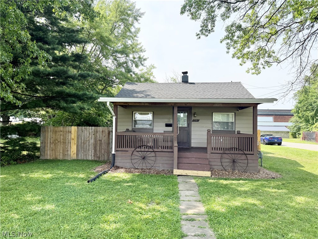 Investor opportunity! This charming bungalow is packed with updates and already generating rental income. The current tenant has a signed lease through May 1, 2027, would love to stay, making this a true turnkey investment property. Inside, the home offers 1 bedroom, 1.5 bathrooms, and a full basement. Major updates completed in 2022 include a new roof, furnace, hot water tank, electrical panel, most windows, and a new gas line to the street. Additional improvements include fresh paint and updated flooring. Enjoy outdoor living with a covered front porch, covered rear patio, and a new wooden privacy fence, creating a private space to relax or entertain. A standout feature is the impressive 40’ x 24’ detached 3-car garage/outbuilding, complete with three overhead doors, a concrete floor, abundant built-in cabinetry for exceptional storage and organization, and drywall with insulation. The outbuilding also features a wood burner that efficiently heats the entire space, making it ideal for year-round use. Whether you’re a hobbyist, woodworker, car enthusiast, or simply need extra room for storage or projects, this versatile building offers endless possibilities. This well-maintained property combines modern updates, excellent amenities, and immediate rental income—an outstanding addition to any investment portfolio.