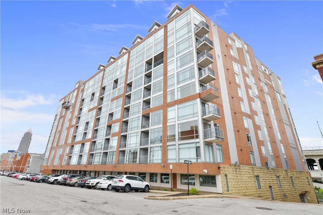Gorgeous and updated Stonebridge Condominium. Eighth floor unit offering wonderful views of the Veterans Memorial Bridge, Cuyahoga River and Downtown Cleveland. What experience are you looking for from your Urban home? Do you want to be within minutes of The Flats, Edgewater, Whiskey Island, Ohio City, Hingetown, Tremont and Downtown Cleveland? or do you get excited knowing you can step out of the building onto the Centennial bike trail? How about green space just down the street at Heritage Park? All of these wonderful amenities are what you can expect to experience when you move in to this cool City condo. A sleek updated space with new low maintenance luxury vinyl plank flooring, and modern paint throughout. Kitchen offers ample cabinetry, granite countertops and center island with bar seating. Two bedrooms including a master bed with private en suite, the perfect guest or office space, in-suite laundry, balcony off a wonderful open concept great room for entertaining or enjoying yo