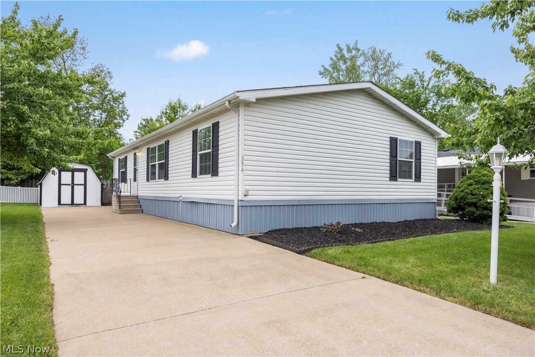 Feels like a vacation home! Welcome to Twin Lakes, a quiet 55+ community with something for everyone! This is a spacious 3-bedroom, 2 full-bath, custom home built in 2005 by Legacy with an open concept layout, and fenced yard. Professionally landscaped. This stunning home shows like new! The large eat-in kitchen has a breakfast bar with bar stools, and opens to the great room with Living room, Dining room and Kitchen combined. Vaulted ceiling with Oak beam and oak trim. The kitchen has beautiful solid oak cabinets, lots of counter space, built in dishwasher, stainless steel appliances, electric, smooth-top stove, and new refrigerator with French doors and ice maker. The large master bedroom has his and hers closets, and an on-suite bathroom with step-in shower and recessed lighting. There are two spacious guest bedrooms and a full bathroom at the other end, making this a private retreat for you and your guests. Central Air conditioning keeps you cool all summer. Laundry room includes top of the line washer and dryer. New hot water tank in '21. There is also a large shed with plenty of storage room. Concrete driveway with room for at least 3 cars easily. This community has plenty of activities for residents, such as game nights, line dancing, bingo, book club, and more. The beautiful community center and fitness room are free to use for the residents as well! There is a nice patio and fire pit to enjoy there also. Make your appointment to see this amazing home today!